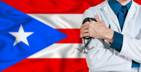 Puerto Rican healthcare concept. Doctor with stethoscope on Puerto Rico flag. Doctor holding stethoscope on Puerto Rican flagの写真素材