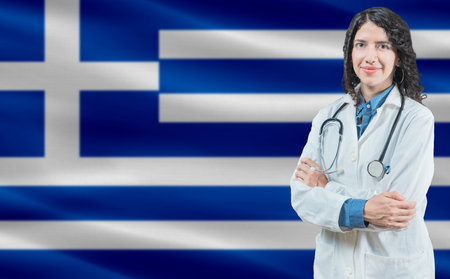 Greek medicine and healthcare concept. Close up of doctor against Greece flag backgroundの写真素材