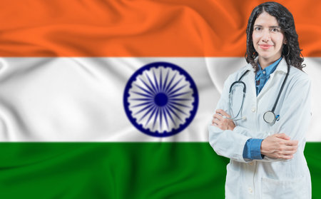 Indian medicine and healthcare concept. Doctor close up against India flag backgroundの写真素材