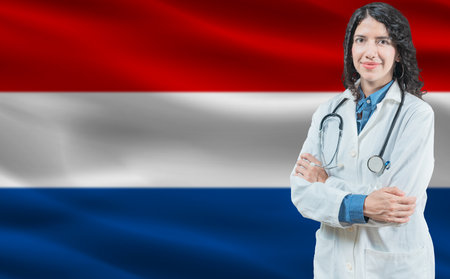 Dutch medicine and healthcare concept. Close up of doctor against Netherlands flag backgroundの写真素材