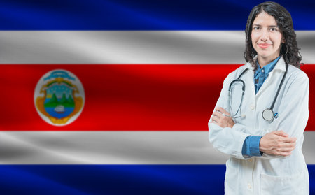Costa Rican medicine and healthcare concept. Close up of doctor against Costa Rica flag backgroundの写真素材
