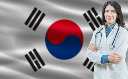 South Korean medicine and healthcare concept. Close up of doctor against South Korea flag backgroundの写真素材