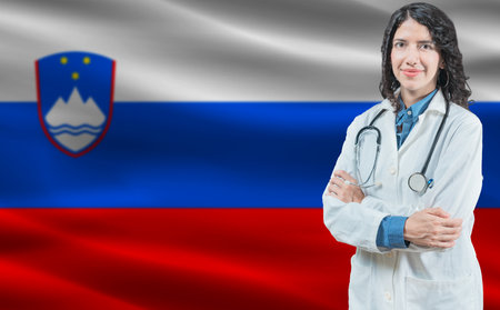 Slovenian medicine and healthcare concept. Close up of doctor against Slovenia flag backgroundの写真素材