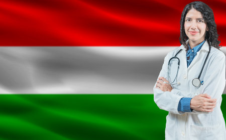Hungarian medicine and healthcare concept. Close up of doctor against Hungary flag backgroundの写真素材
