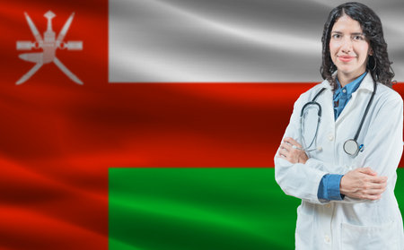 Oman medicine and healthcare concept. Close up of doctor against Oman flag backgroundの写真素材