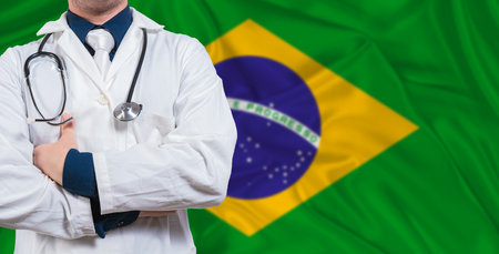 Male doctor with stethoscope on Brazil flag. Doctor holding stethoscope on Brazil flagの写真素材