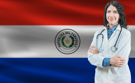 Paraguayan medicine and healthcare concept. Doctor close up against Paraguay flag backgroundの写真素材