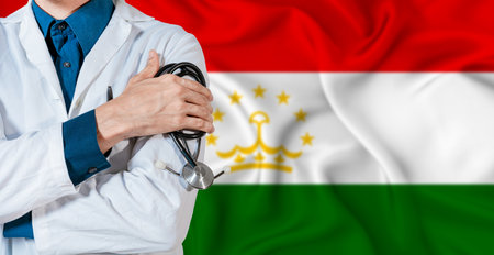 Tajikistan healthcare concept. Doctor with stethoscope on Tajikistan flag. Doctor holding stethoscope on Tajikistani flagの写真素材