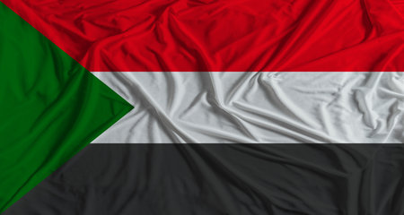Sudan flag with fabric texture background National flag of Sudan with cloth textureの写真素材