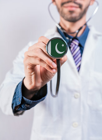 Pakistan health and medical insurance concept. Pakistan healthcare system, doctor holding stethoscopeの写真素材