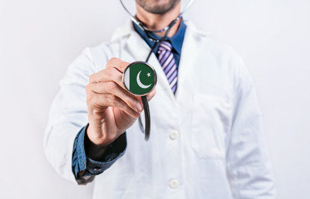 Pakistan healthcare system, doctor holding stethoscope. Pakistan health and medical insurance conceptの写真素材