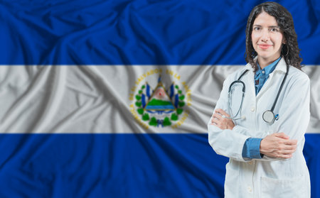 Salvadoran medicine and healthcare concept. Doctor close up against El Salvador flag backgroundの写真素材