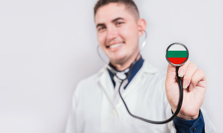 Doctor showing stethoscope with Bulgaria flag. Bulgaria national healthcare conceptの写真素材