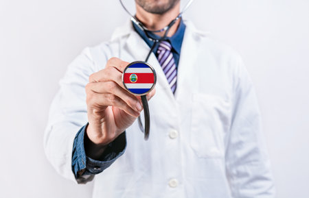 Costa Rica Healthcare System, doctor holding stethoscope. Costa Rica health and medical insurance conceptの写真素材