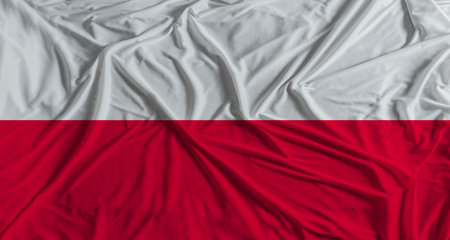 Polish flag with fabric texture background. National flag of Polandの写真素材