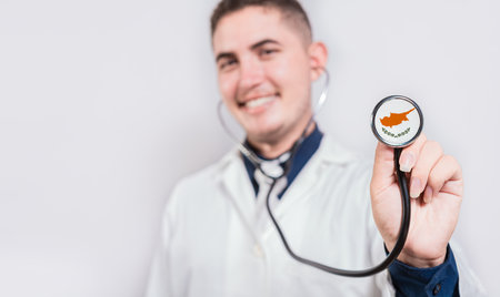 Doctor showing stethoscope with Cyprus flag. Cyprus national healthcare conceptの写真素材