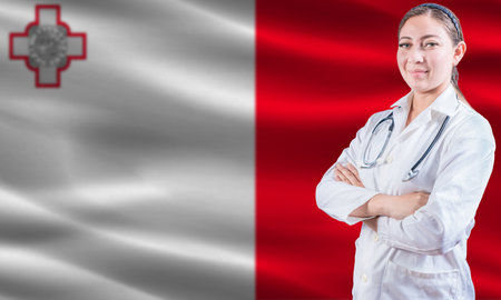 Female doctor on Malta flag. Doctor with crossed arms on Malta flag. Malta health and care conceptの写真素材