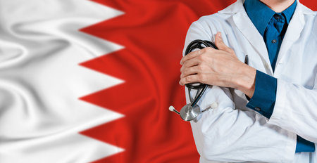 Doctor with stethoscope on Bahrain flag. Doctor holding stethoscope on Bahrain flagの写真素材