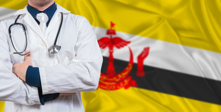 Male doctor with stethoscope on Brunei flag. Doctor holding stethoscope on Brunei flagの写真素材