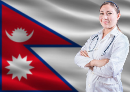 Female doctor on Nepal flag. Doctor with crossed arms on Nepal flag. Nepal health and care conceptの写真素材