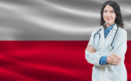 Polish medicine and healthcare concept. Doctor close up against Poland flag backgroundの写真素材
