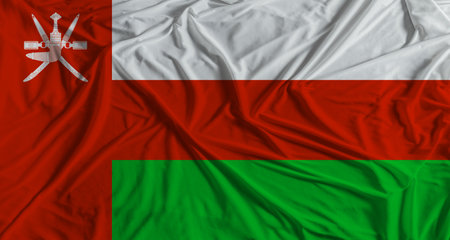 Omani flag with fabric texture background. National flag of Oman with cloth textureの写真素材