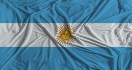 Argentina flag with fabric texture background. National flag of Argentina with cloth textureの写真素材