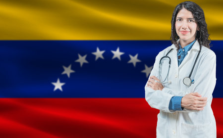 Venezuelan medicine and healthcare concept. Doctor close up against Venezuela flag backgroundの写真素材