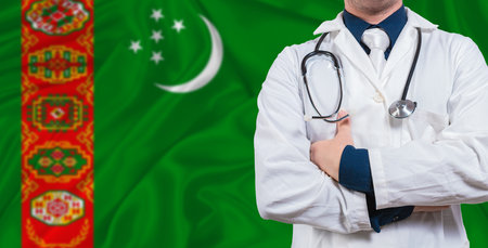 Male doctor with stethoscope on Turkmen flag. Doctor holding stethoscope on Turkmenistan flagの写真素材