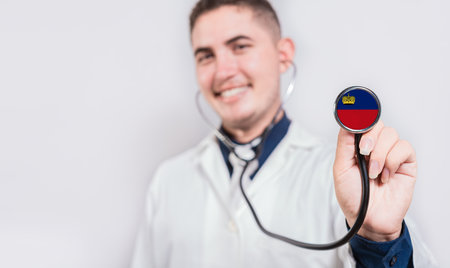 Doctor showing stethoscope with Liechtenstein flag. Liechtenstein national healthcare conceptの写真素材