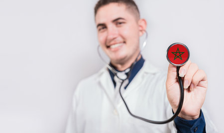 Doctor showing stethoscope with Morocco flag. Morocco national healthcare conceptの写真素材