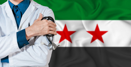 Syria healthcare concept. Doctor with stethoscope on Syria flag. Doctor holding stethoscope on Syrian flagの写真素材
