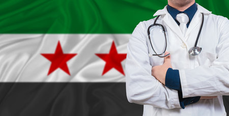 Male doctor with stethoscope on Syria flag. Doctor holding stethoscope on Syria flagの写真素材