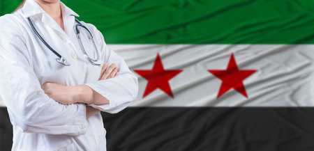 Doctor with crossed arms on Syria flag. Syrian health and care concept. Female doctor on Syria flagの写真素材