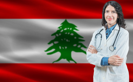 Lebanese medicine and healthcare concept. Doctor close up against Lebanon flag backgroundの写真素材