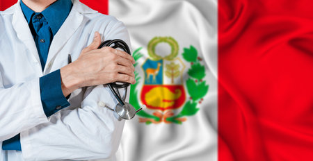Peru healthcare concept. Doctor with stethoscope on Peru flag. Doctor holding stethoscope on Peruvian flagの写真素材