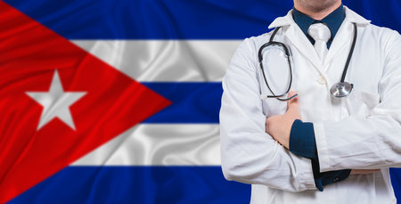 Male doctor with stethoscope on Cuba flag. Doctor holding stethoscope on Cuba flagの写真素材