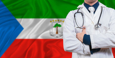 Male doctor with stethoscope on Equatorial Guinea flag. Doctor holding stethoscope on Equatorial Guinea flagの写真素材