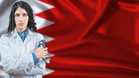 Bahraini national health system, Medical professional on Bahrain flag backgroundの写真素材