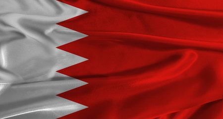 Flag of Bahrain with fabric textured background. Close up of National flag of Bahrain with realistic...