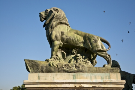 Stone lion  It is part of Monument to King Alfonso XII, located in Retiro Park, Madrid, Spain   The monument is 30 meters high, 86 meters long, and 58 meters wide and was designed by Jose Grases Riera, and inaugurated on June 6, 1922 のeditorial素材