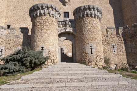 Entrance door of the New Castle of Manzanares el Real, Madrid Province, Spain  Also known as Castle of los Mendoza, is a palace-fortress erected in the 15th century のeditorial素材