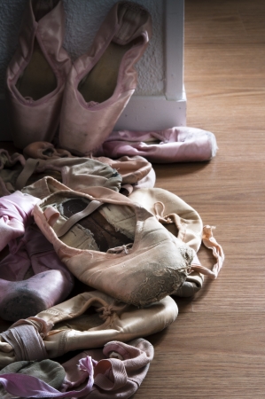 Group of pointe shoes on wooden floorの写真素材
