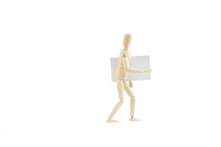 articulated wooden dummy showing a business card, isolated on white backgroundの写真素材