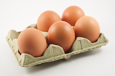 egg carton with eggs isolated on white backgroundの写真素材