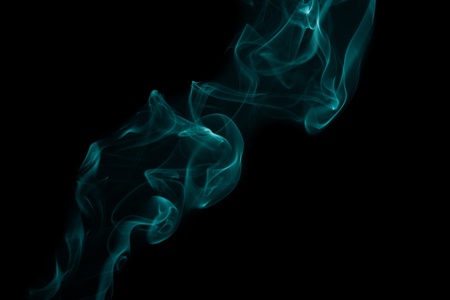 abstract forms created with blue smoke isolated backgroundの写真素材