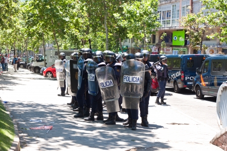 riot policemen against protesters prepared in a strike in Madridのeditorial素材