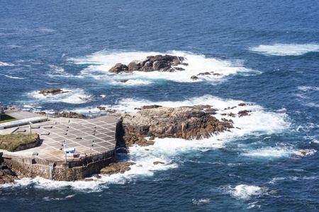 rock in the middle of the oceanの写真素材