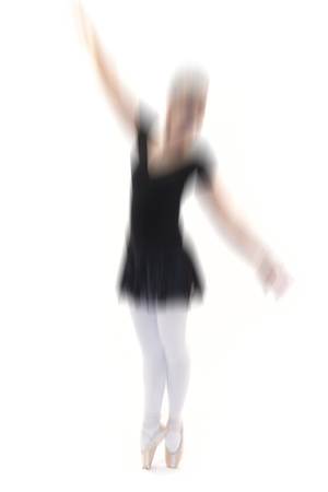 young ballet dancer posing on white backgroundの写真素材
