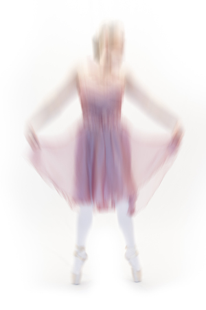 young ballet dancer posing on white backgroundの写真素材
